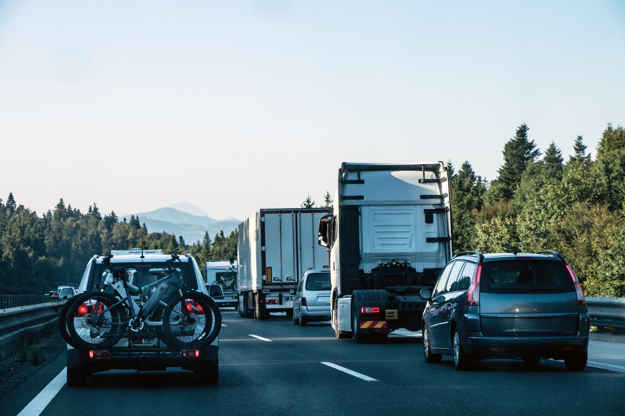 Cars and trucks in traffic on the highway during spring break travel.