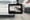 A camera mounted inside a vehicle filming traffic ahead on the highway.